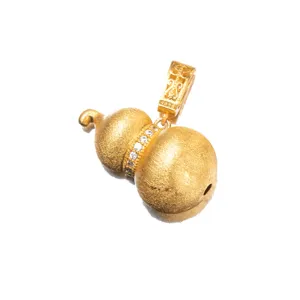 Macro detail of a matte gold S925 silver gourd pendant with micro-inlaid clear stones