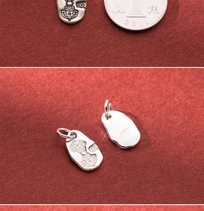 Detailed macro view of S925 sterling silver Vajra pestle charm with vintage antique finish