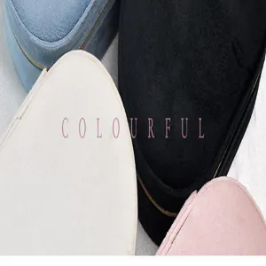 Close-up detail of multi-colored velvet jewelry boxes highlighting a soft texture.