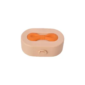 Boîte à bijoux compacte avec une jolie poignée en nœud orange en beige