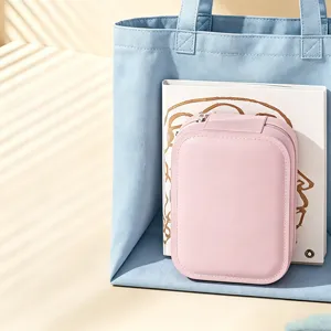 Portable pink LED light mirror makeup box and jewelry organizer in a blue tote bag