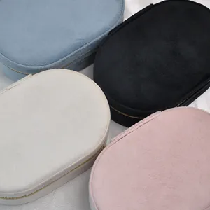 Set of portable oval velvet jewelry boxes in assorted colors for travel storage