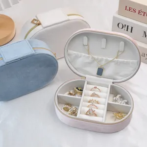 Portable oval velvet jewelry organizer box for rings and earrings in multiple soft colors