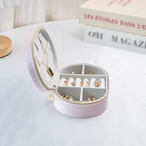 Elegant pink oval velvet jewelry travel storage case with multiple inner compartments
