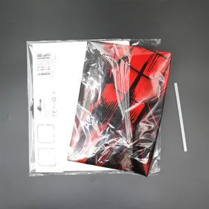 Close-up detail of a red and black themed party balloon in original clear packaging