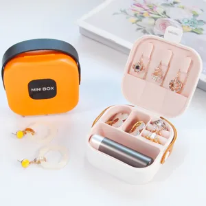 Compact portable jewelry box organizer for rings, necklaces, and lipstick with handle