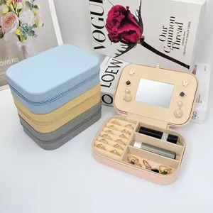 Elegante portagioie portatile in PVC con specchio integrato e scomparti multipli per viaggi.