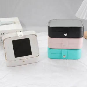 Portable PU leather jewelry organizer box with mirror for earrings rings necklaces.