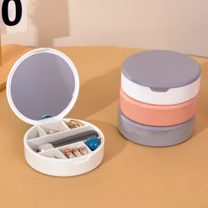 Boîte à bijoux ronde portable avec miroir et compartiments pour bagues et rouge à lèvres