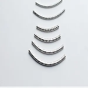 Close-up of S925 sterling silver diamond-cut curved tube beads for DIY jewelry making.