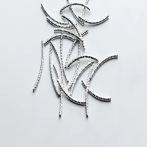 Detailed macro view of S925 sterling silver faceted curved tubes for DIY jewelry making
