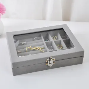 Boîte à bijoux en velours gris avec couvercle en verre transparent pour accessoires