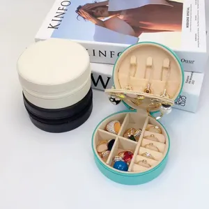 Elegante joyero redondo portátil de cuero PU para anillos, pendientes y collares de mujer