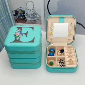 Boîte à bijoux portable en similicuir sarcelle avec lettre E fleurie et miroir intégré