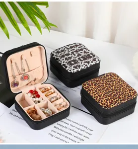 Portable jewelry organizer boxes with cow and leopard prints and organized velvet interior