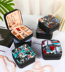 Macro view of portable jewelry organizer box featuring various stylish Western patterns