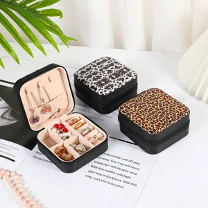 Portable square jewelry organizer box with leopard and cow print designs for rings