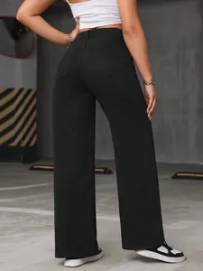 Back view detail of high-waisted black wide-leg denim jeans featuring functional pockets