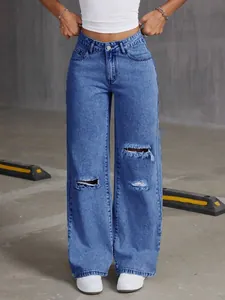 Stylish high-waisted wide-leg jeans in light blue washed denim with ripped details.