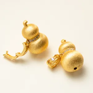 Detailed view of brushed gold S925 silver gourd pendants with micro-inlaid cubic zirconia