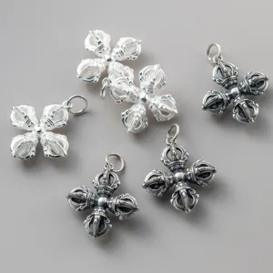 Detailed view of 925 sterling silver aged Vajra pendants for DIY jewelry making.