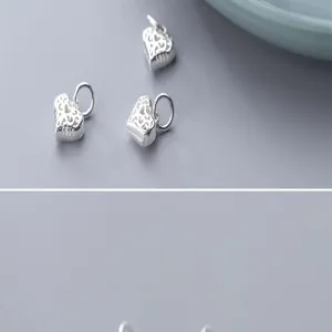 Vue macro du pendentif cœur évidé en argent S925 pour création de bijoux DIY