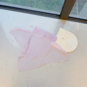 High-quality detail of light pink sun protection face mask with breathable neck veil drape