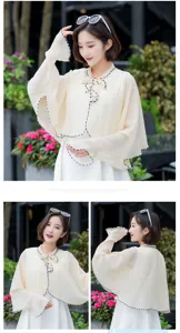 Detail of women's chiffon sun protection cape with elegant bow tie and scalloped edges.