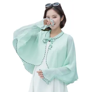 Lightweight mint green chiffon sun protection cape for women with bow-tie detail.