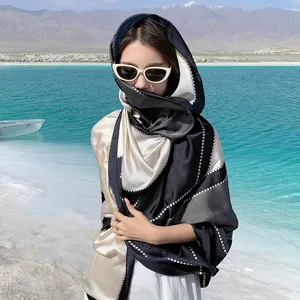 Elegant black and cream patterned silk-like sun protection shawl scarf for beach travel photography