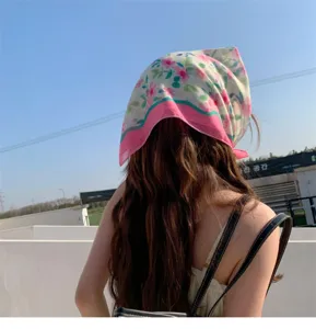 Back view detail of a floral cotton linen headscarf styled as a trendy pink bandana