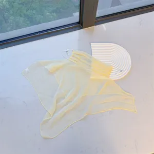 Lightweight yellow sun protection face veil with adjustable ear loops for neck coverage