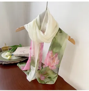 Close-up of elegant floral print georgette long scarf draped on a wooden hanger in a lifestyle scene