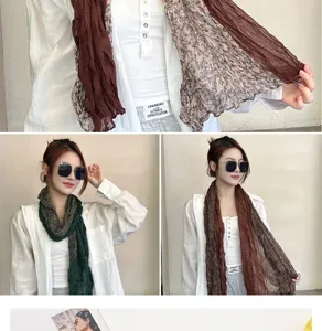 Detailed view of lightweight cotton floral pleated scarves in brown and green colors