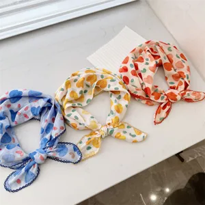A group of three 100% cotton neckerchiefs with heart patterns and delicate lace edges