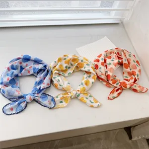 Set of three lightweight heart-patterned cotton neck scarves in blue, yellow, and red.