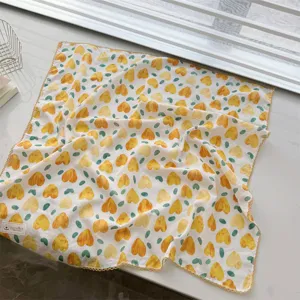 Close-up detail of 100% cotton square scarf with yellow heart prints and lace trim.