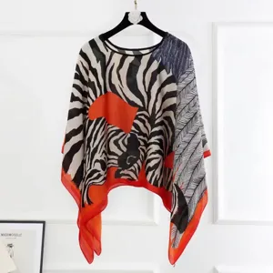 Elegant zebra and leaf print pullover poncho shawl for women with orange border details