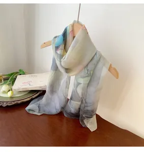 Elegant lightweight Georgette silk scarf with floral pattern display on a wooden hanger
