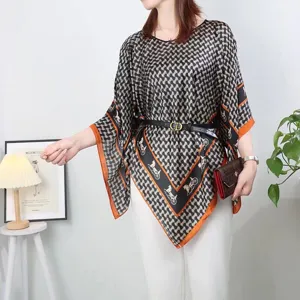 Elegant printed silk shawl poncho with carriage pattern worn by model with belt