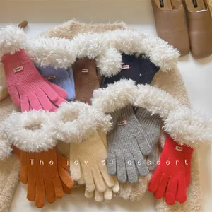 Detailed view showing a variety of colorful knit gloves with cozy faux shearling cuffs