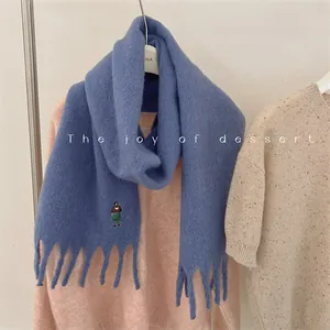 Blue wool blend thick scarf with fringe and cute embroidered girl design detail