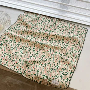Detailed view of 100% cotton floral square scarf with delicate black lace trim