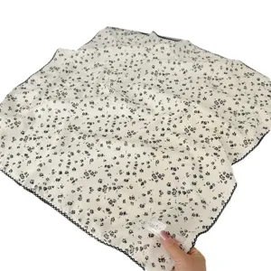 Elegant 100% cotton square scarf with delicate black floral pattern and scalloped edges