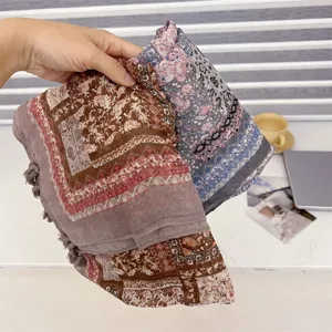 Close-up of retro ethnic scarf showing geometric paisley print and soft cotton-linen texture