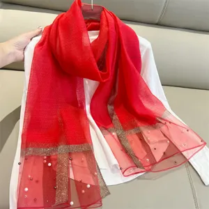 Red imitation silk scarf featuring elegant pearls and gold glitter stripes on mesh ends