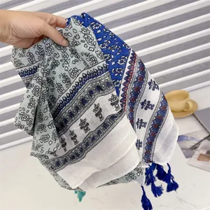 Detailed view of Bohemian cotton linen scarf featuring intricate porcelain prints and tassels