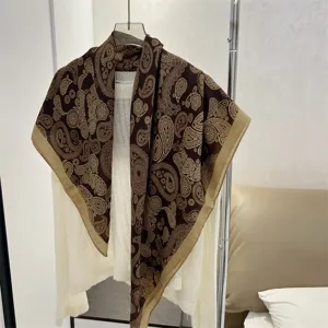 Detailed view of 90cm cotton linen paisley square scarf in brown and beige tones