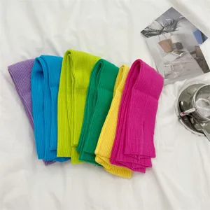 Set of colorful ribbed knit long fingerless arm warmers in vibrant dopamine shades