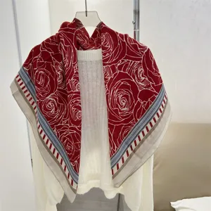 Detailed view of red rose floral print on a 90cm cotton linen square scarf